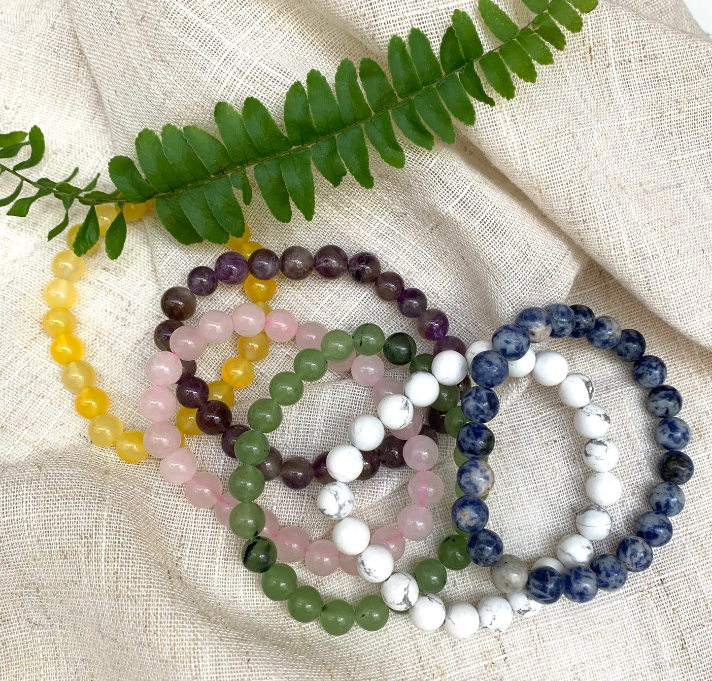 Gemstone Bracelets £10 Beautiful elasticated bracelet with smooth rounded stones Each gemstone carries different properties. Amethyst, Honey Crystal, Jade, Rose Quartz, Sodalite, White Jasper This is a fairly traded product.