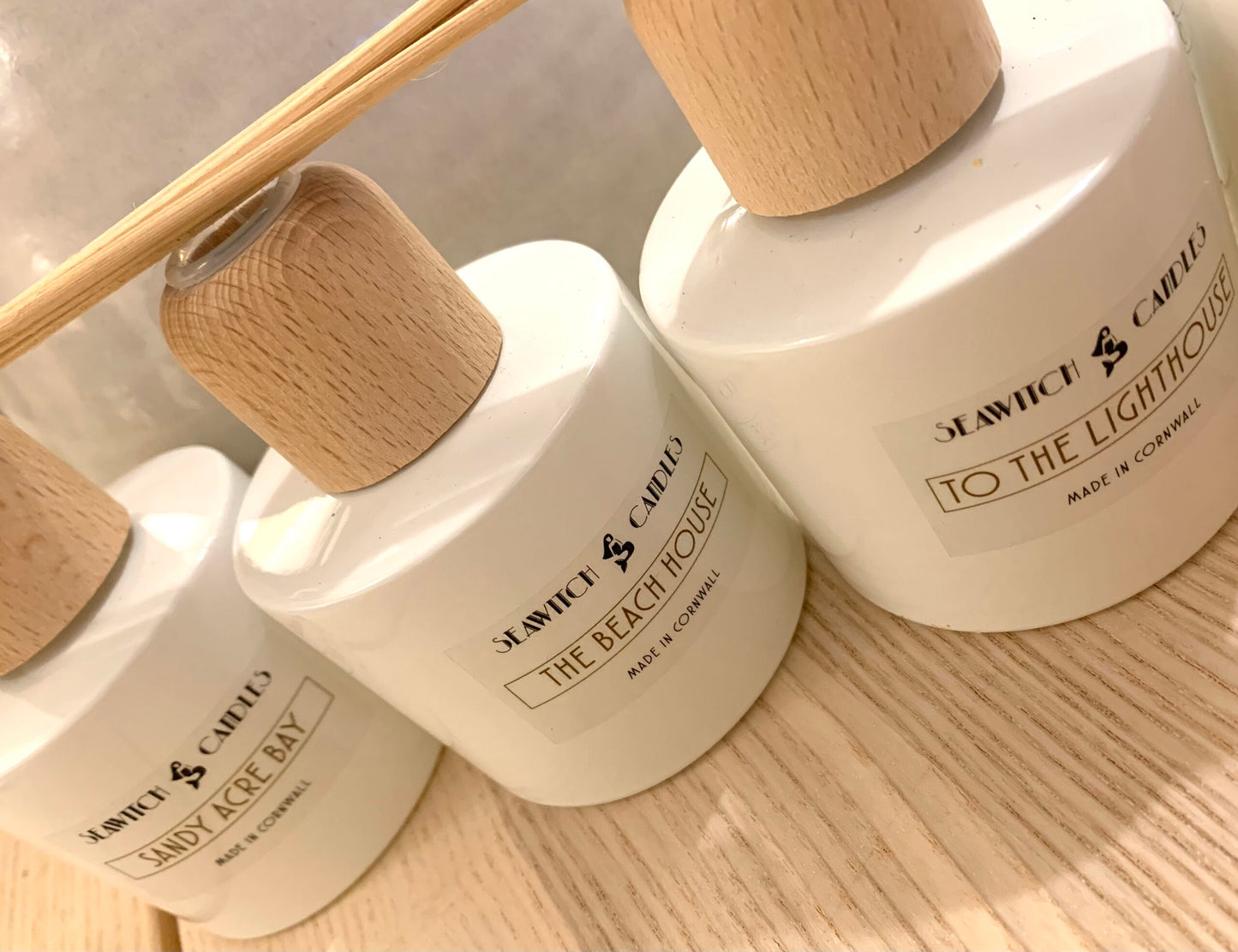 The Beach House Diffuser £22 Jasmine – Lavender – Sandalwood Subtle elegant floral's blend sumptuously with the soft creaminess of fragrant precious woods. This 100 ml diffuser releases a constant aroma to scent your room beautifully for at least 12 months. This diffuser is handmade in Mousehole, Cornwall by Seawitch Candles. Ingredients: Base oil & fragrance oils – comes with 6 natural reeds.