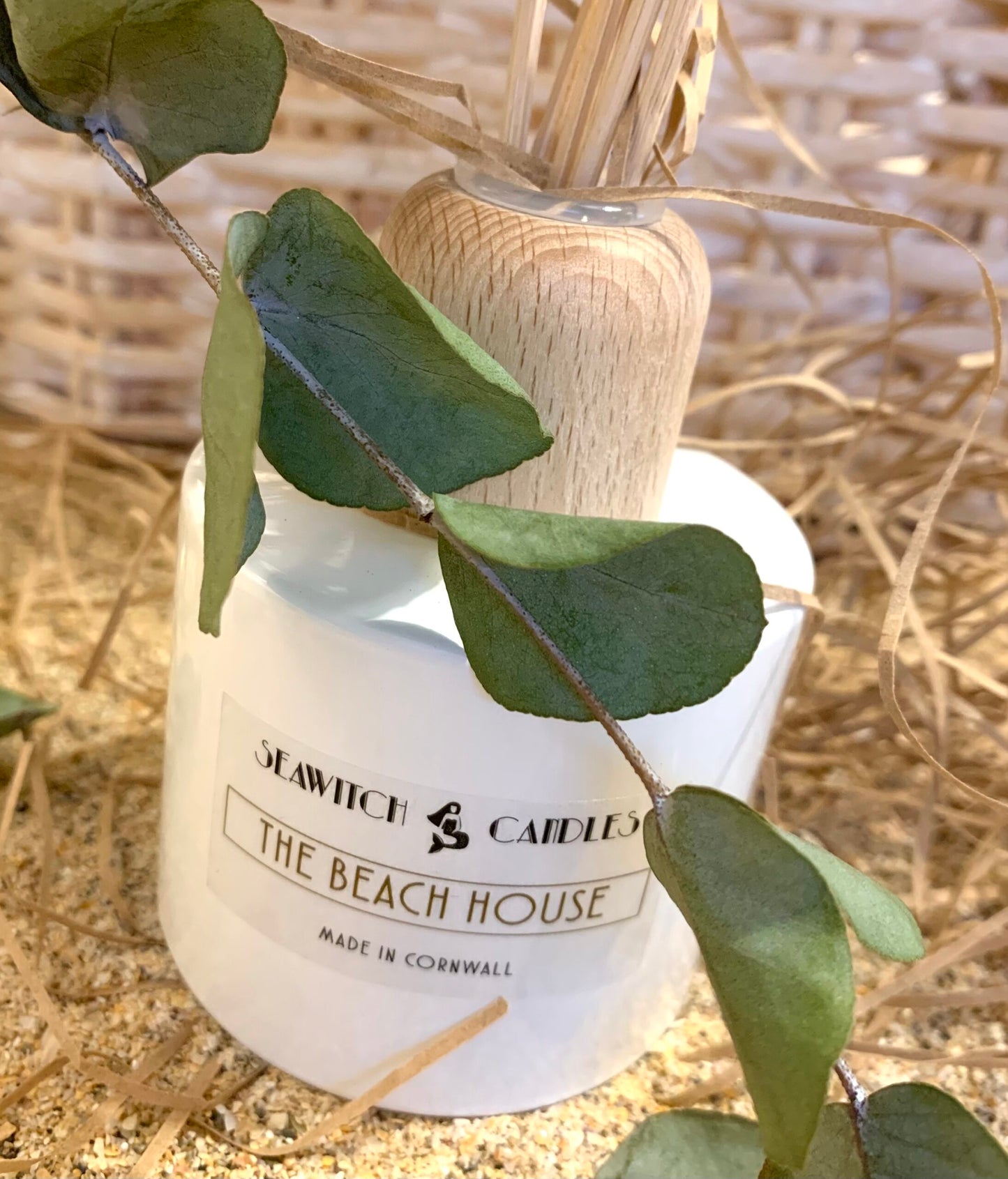 The Beach House Diffuser £22 Jasmine – Lavender – Sandalwood Subtle elegant floral's blend sumptuously with the soft creaminess of fragrant precious woods. This 100 ml diffuser releases a constant aroma to scent your room beautifully for at least 12 months. This diffuser is handmade in Mousehole, Cornwall by Seawitch Candles. Ingredients: Base oil & fragrance oils – comes with 6 natural reeds.
