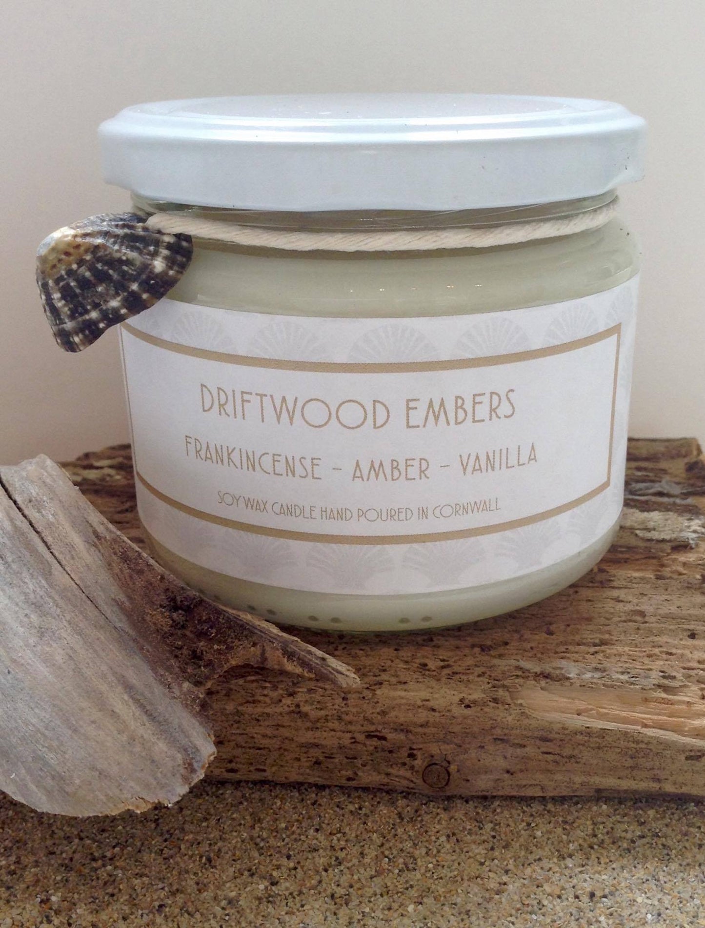 Driftwood Embers Candle Frankincense - Amber - Vanilla £20 Citrus top notes lead to a heart of musky spices resting on a warm vanilla base Ingredients: natural plant wax, fragrance oils Shell may vary to image shown Double wicked plant wax candle . Burns for approx 40 hours. Made in Cornwall by Seawitch Candles " Cosy and comforting with a hint of smokiness. We have bought 6 and counting! Our favourite candle ever." - Joe and Deb