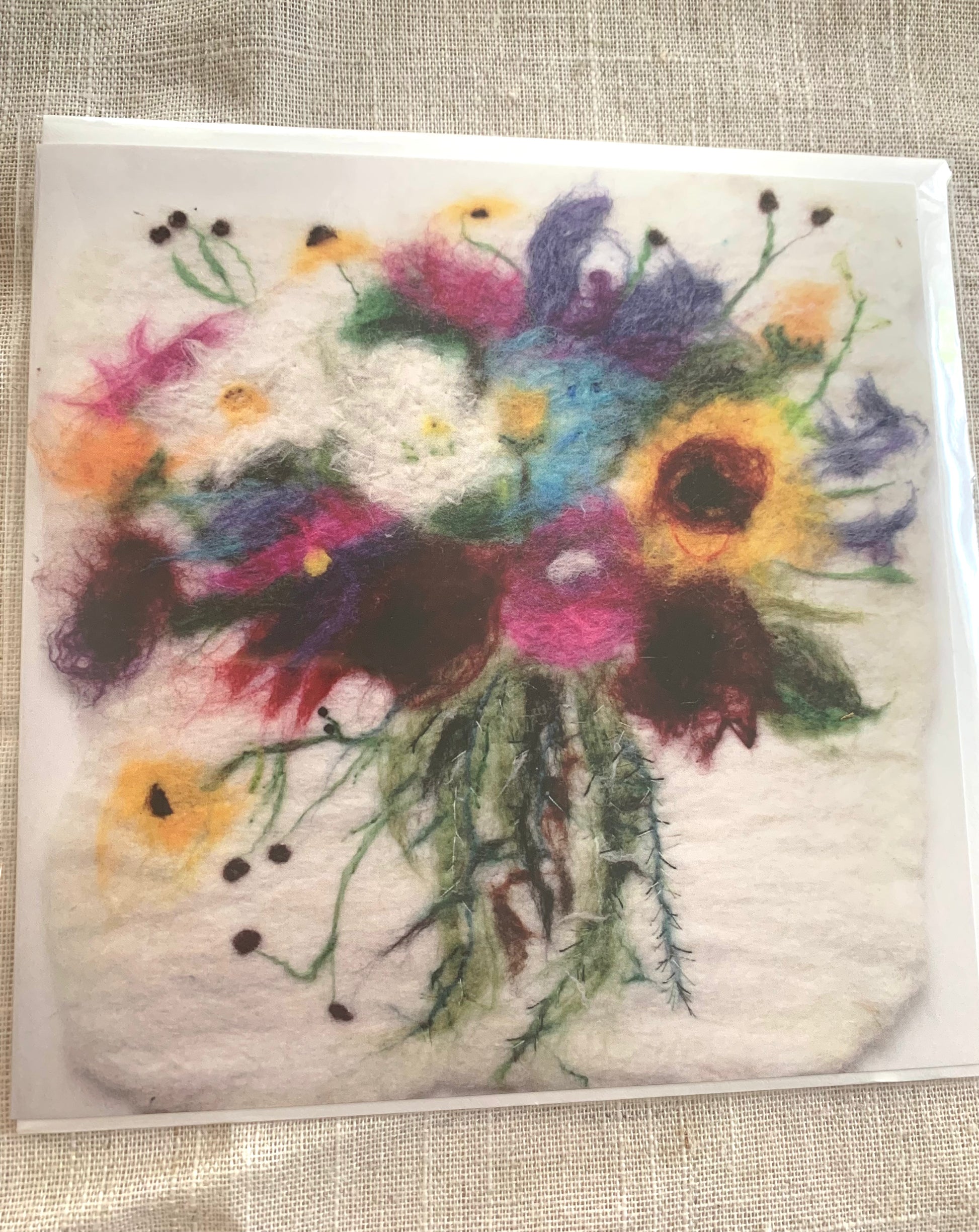 Card from an original felting by Cornish based artist, Rowena &nbsp;Scotney  A felting of a beautiful bouquet of wildflowers, with added beading and stitching.  'Sometimes I only need to stand where I am to be blessed'&nbsp; by poet Mary Oliver - written on the back of the card  Square Greeting Card - 148.0mm x 148.0mm Shop small. Shop Independent. Shop Cornwall. Mousehole.