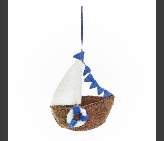 Handmade Felted Sailboat Hanging Decoration  £14  Just one of many super cute handmade felt decorations &nbsp;we have in store  Dimensions: 11cm x 9cm Material: 100% wool  Eco friendly &amp; Bio degradable. Suitable from: 3 years  This is a fair trade product from Nepal She fair trade Seawitch Stores 
