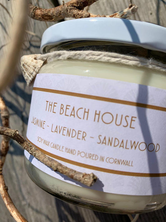 The Beach House Candle  £20  Jasmine – Lavender – Sandalwood    Subtle elegant floral's blend sumptuously with the soft creaminess of fragrant precious woods.  Ingredients: natural plant wax, fragrance oils.  Shell may vary to image shown  Double wicked plant wax candle. Burns for approx 40 hours. Made in Cornwall by Seawitch Candles  &nbsp;"this scent makes my home smell beautiful - so many of my friends have commented on it when they walk into my living room" Geraldine Hardy