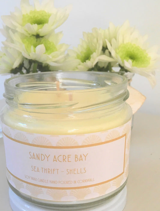 Sandy Acre Bay Candle  £20  Sea Thrift – Shells  Cool sea air and salty pebbles mingle with the delicate floral's of dune grass and sea thrift  Ingredients: natural plant wax, fragrance oils  Shell may vary to image shown  Double wicked plant wax candle . Burns for approx 40 hours. Made in Cornwall by Seawitch Candles    "Love love love this candle - best candle I have ever bought and I have bought a LOT of candles !!!!" Davina Davies coastal style, coastal living, coastal life